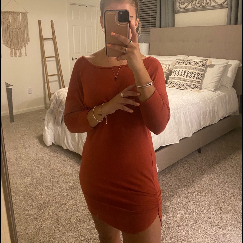 Rust colored dress, ruched on the sides.